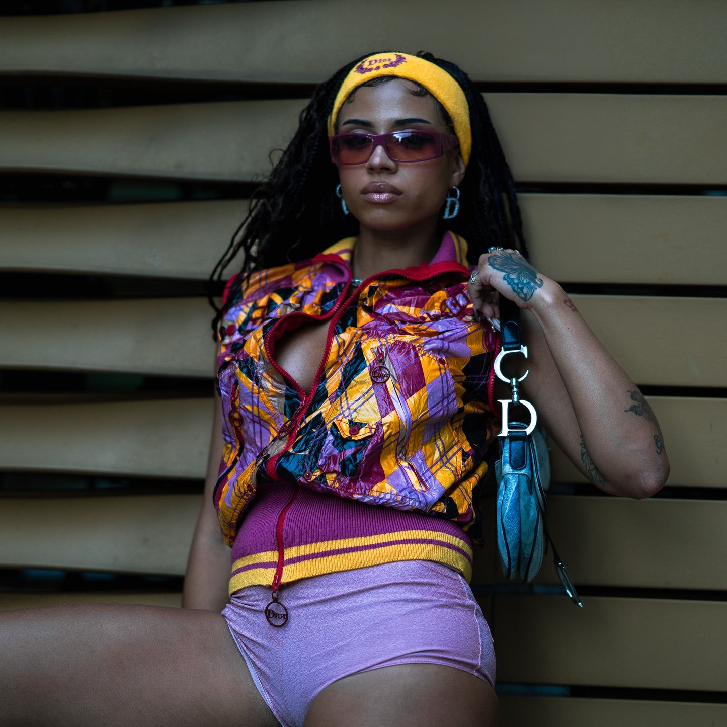 Purple and orange Dior “Your Dior 2” logo sunglasses by Galliano.