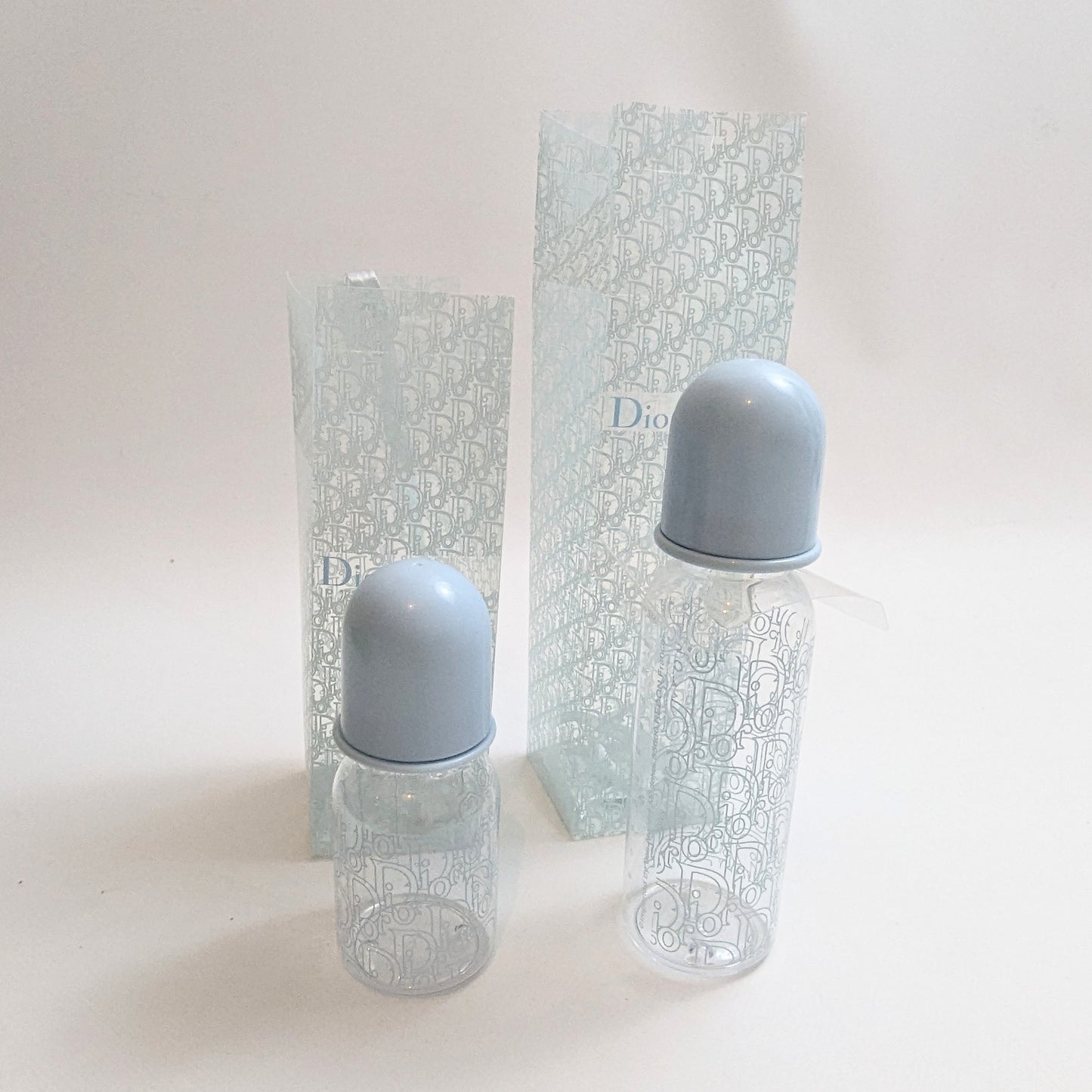 Set of two blue monogram Dior baby bottles