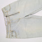 Dior jeans by Galliano decorated with a silver plaque signed “Dior” - S/M