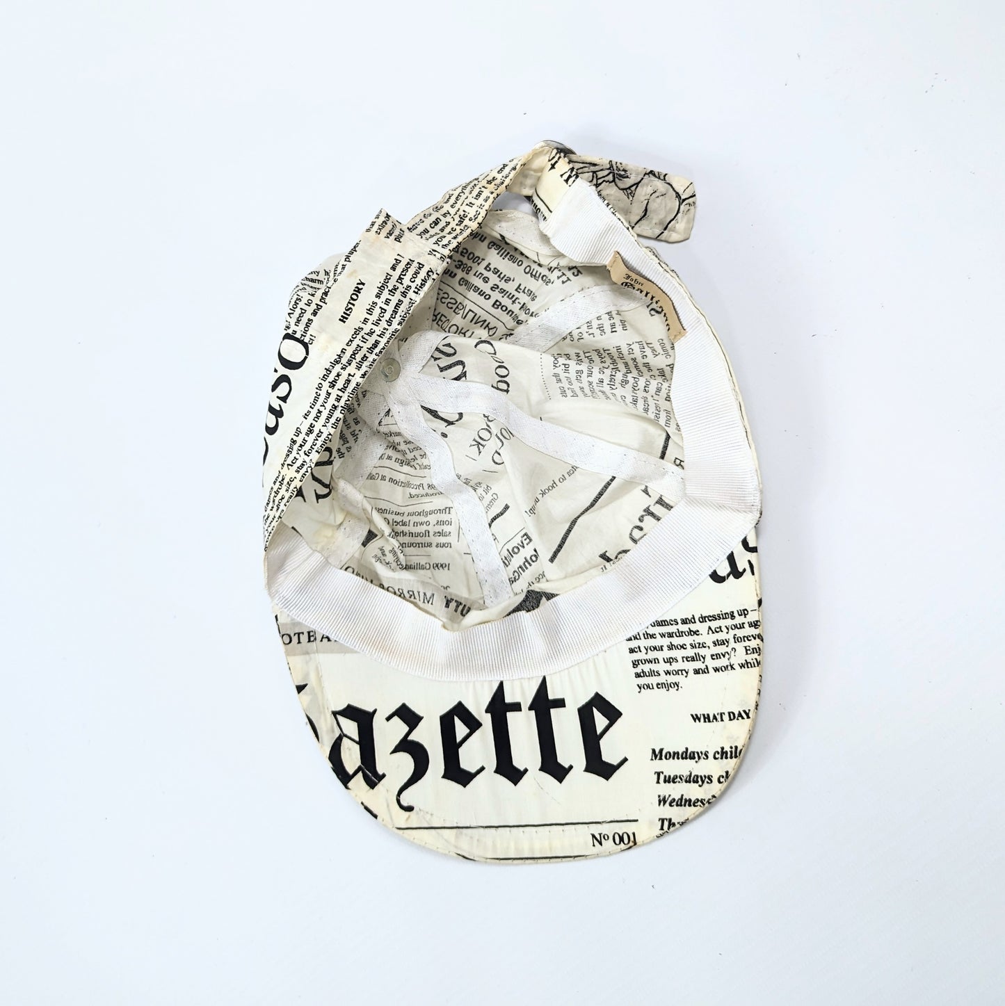 Galliano newspaper pattern cap