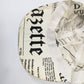 Galliano newspaper pattern cap