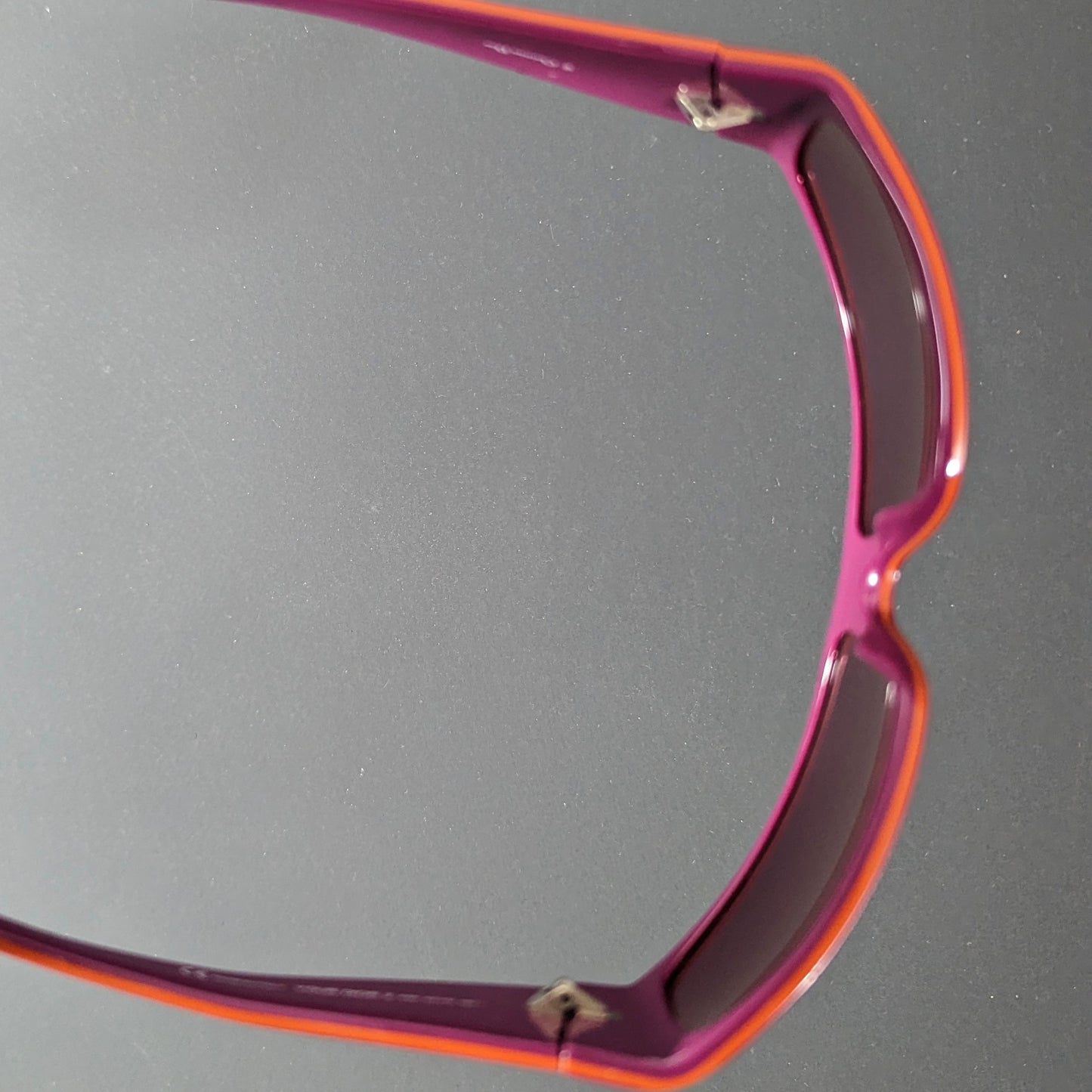 Purple and orange Dior “Your Dior 2” logo sunglasses by Galliano.