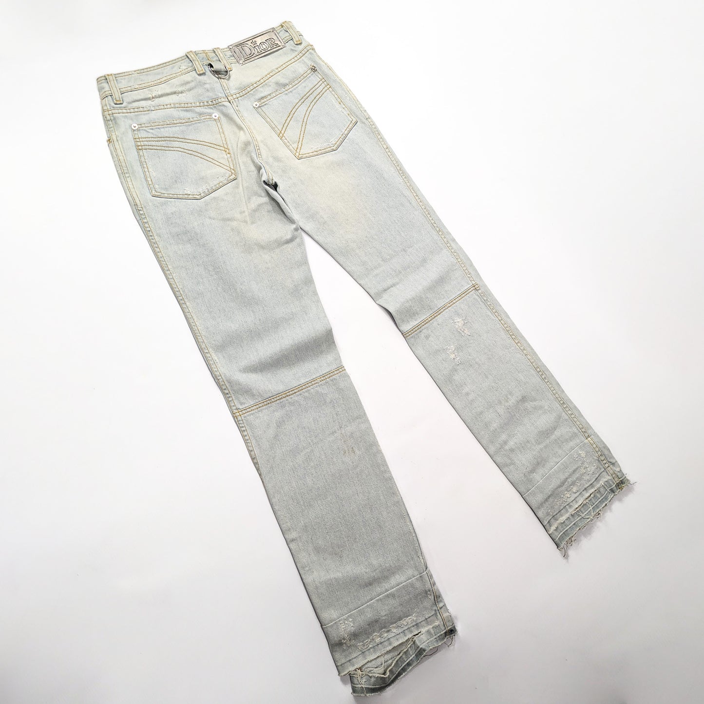 Dior jeans by Galliano decorated with a silver plaque signed “Dior” - S/M